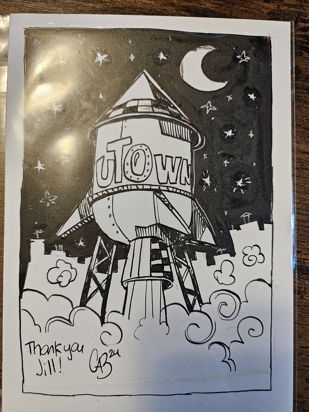 Black ink drawing of a rocketship shaped water tower for uTown, drawn by Cab