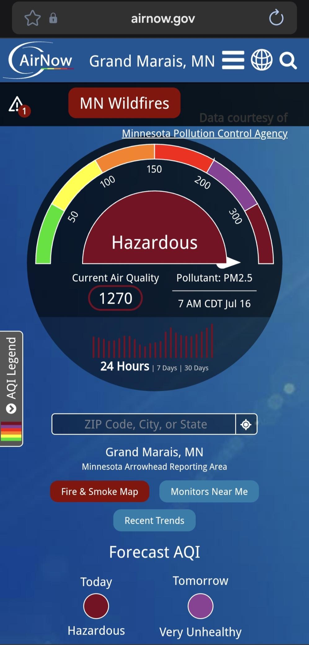 Airnow.gov screenshot for 7am CDT Jul 16 at Grand Marais MN, alerting to MN eildfires. A green to dark red circular gauge for air quality. <50 is green. <100 is yellow. < 300 is purple. Above 300 is dark red. Current air quality at Grand Marais is 1270.